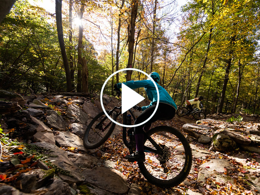 Mountain biker on a rocky trail in the fall