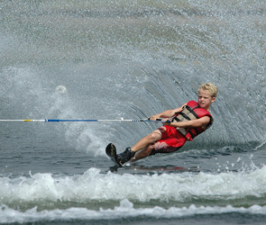 Kid on a water ski.