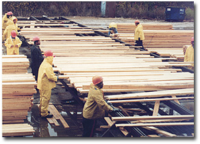 Men working at a lumber yard.