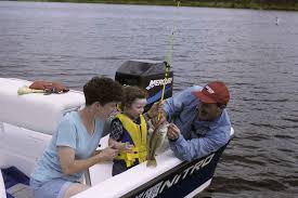 Child with Parents Fishing with a PFD on
