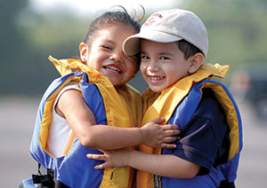 Two children with their life jackets on
